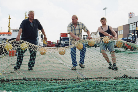 fishermen repairing their net